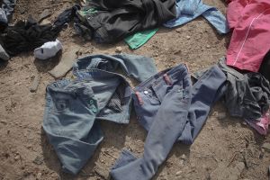Unusable clothes which were thrown out by the victims of earthquake . The reason for this action is that the local people often wear regional clothing which is specific to their culture and they avoid wearing fashionable clothes