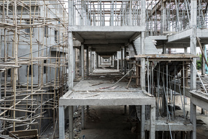 View across a building site on the out skirts of Phnom Penh. The site builds houses for an emerging middle class and overseas investors.