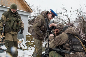 Pro-Russian rebel commander, 'Communist' supervises a machine grenade launcher position outside Debaltseve.