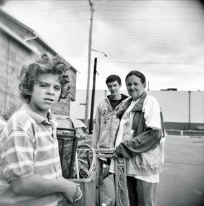 Scrapper family with metal items picked from alleyways arrive at the scrap yard to sell the metal for cash.