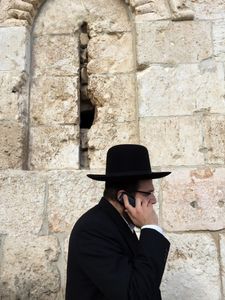Hassid (religious Orthodox Jew) on cell phone, Jerusalem, Israel