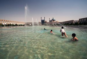 Esfahan, Iran: In the hot July afternoon the children refresh themselves in the lake on Imam's square. © Matjaz Krivic