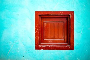 Blue wall, red window