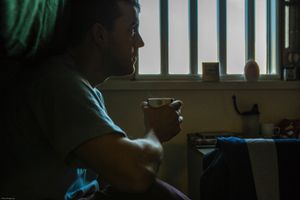 A enhanced prisoner sitting in his cell. HMP/YOI Portland, Dorset