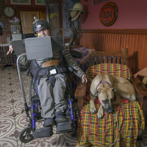 Julius van der Wat in his wheelchair with his dog Jesse.