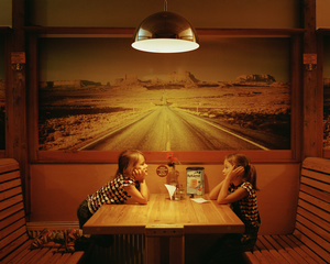 Two young girls playing in a restaurant at Vilnius Bus Station, Vilnius, Lithuania, September 2015.