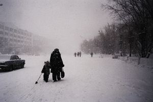Walking under the heavy snow (purga) in Lenin Avenue. Vorkuta.