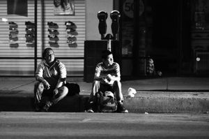Workers arrive on the street as early as 1:30am and wait, sometimes for as long as two hours, to be hired by a labor contractor.  Here Susana and Omar wait to learn if they'll get work.© Joseph Sorrentino