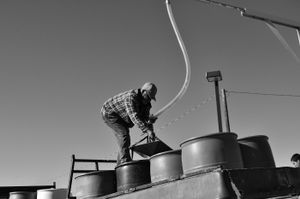 José filling tanks with water. © Joseph Sorrentino