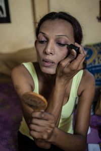 Urmi gets ready for her day of visiting the various hijra communities that she helps to train and advise.  Urmi is a Transgender Representative with The Humsafar Trust.  © Alison McCauley