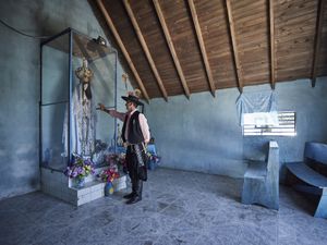 Gauchito Gil devotee at the shrine of the holy virgin in the temple of the popular saint in El Campito de la Carolina
