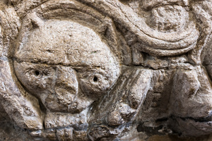 Detail of grotesque figure on the font at St. Lawrence, Castle Rising