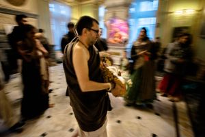 The head pujari carries out small scale representations of Radha Gopinatha, the Radhadesh deities, so that they can be present in the kirtan hall