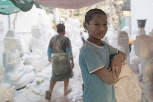 Child labourer at workshop in Mandalay, Myanmar.