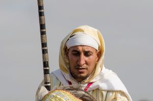 Rider braces his stead at the start of a charge. Oued Merzeg, Morocco