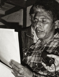 Sr. Perez, resident at the DIF,  reads to international reporters from an official  document that attributes ownership of the forest territory from which he and his community were displaced.