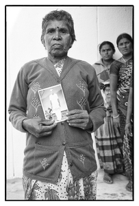 Ramannamma with photo of her deceased husband A. Lakshmaiah, a debt-stressed farmer who committed suicide. Telangana, India.
