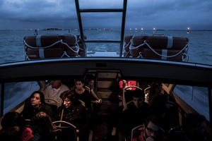 People ride the water bus or vaporetto from the islands in the north lagoon back to the city of Venice on September 23, 2012. The wide lagoon is in fact only a meter deep. The boat routes are a clearly marked deepened canal system.