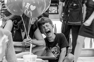 Kyiv -- a boy cries and throws a 'fit' when he becomes overstressed during his birthday party at downtown Kyiv's most central McDonalds.  The international chain  restaurants are found throughout Ukraine much as they are also in neighboring Russia.