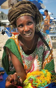 A woman at work on the beach