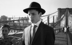 Young man on Brooklyn Bridge.