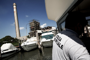 The police monitors the implementation of enviromental laws in the lagoon. Besides poaching and other violations in the lagoon itself, Marghera (in the background), the main source of pollution of the lagoon, remains a major problem.