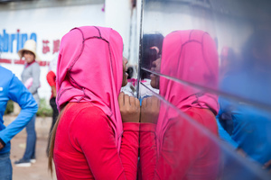 A worker shouts through the factory’s gate demanding a US$3 salary increase.