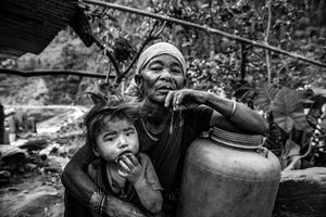 Maldhani Gurung a 70-year-old woman with her granddaughter in the village of Baluwa, Gorkha District, near the epicenter of the 2015 earthquake.