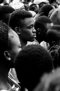 La fête du village - boys in trees and girls in the crowd, waiting for the spectacle to begin in a little village in Burkina Faso.