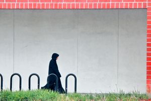 WOMAN IN BLACK WALKING