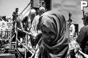 106 Somali migrants land to Malta.They were rescued by the Armed Forces of Malta.They will go trough the process that happens  to everyone who comes this way:identification by the police,request for asylum, imprisonment,access to open centers and then either a future in Malta or the attempt to move to another EU member.Behind them Captain Etienne Scicluna,who was in command of the operation.