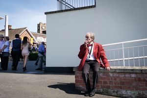 A member of the brass band takes a break.