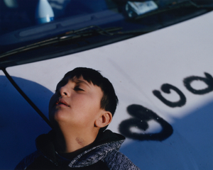 Roberto, young gypsy, in front of the family van // Aubervilliers // December 2019