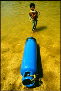 Boy with Blue Canister