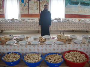 Orthodox monk preparing meals, alms after a religious celebration, the monastery keeper Romania
