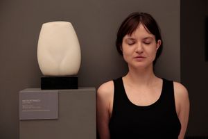 Art critic Cristina Bogdan in front of the sculpture of Milița Pătrașcu, © National Museum of Art, Bucharest