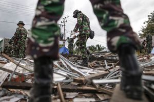 Indonesian National Armed Forces (TNI) clearing the rubble of collapsed buildings following the earthquake in Pidie Jaya, Aceh province, on December 10, 2016.