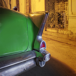A 1958 Vintage Chevrolet stands beneath a street lamp in a street in La Habana Vieja.