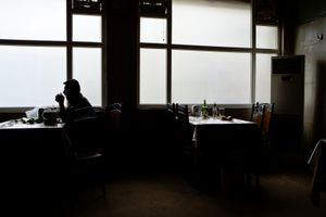 A customer quietly drinks his alcoholic beverage in a speakeasy in Ankawa, the christian district of the city of Erbil. © Tom Verbruggen