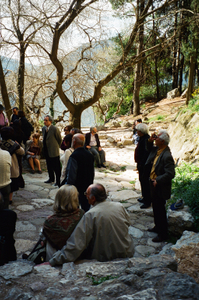 fig.27 Poets at Krystalia Source. Poet Mikhail MITRAS(Greece), on the rock-left part of the photo)