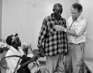 I was surprised to see this woman gently grasp her husband’s hand in reassurance. Witnessing this tender interaction, rarely exhibited even privately between married Kenyan couples, I applauded their resilience, loyalty and enduring love.                          © Lola Reid Allin