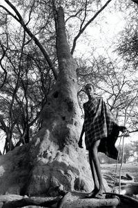 Young Boy With Termite Mount