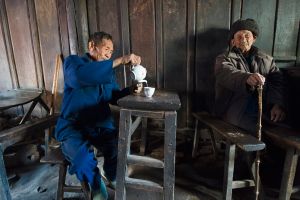 Retired villagers in Banqiao, close to the southwestern Yunnan city of Baoshan, gather every day to pass the the time in a local tea-house that has changed little in its 140 year-old history. © Michael Freeman