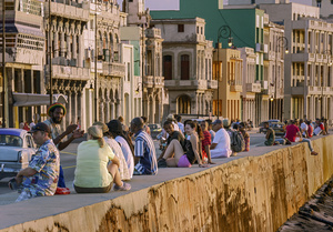 Light at sunset catch the fascades of the Spanish colonial architecture along the Malicón waterfront of old Havana.