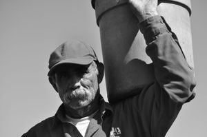 José with a full bucket of chiles, which weighs 20 pounds. © Joseph Sorrentino