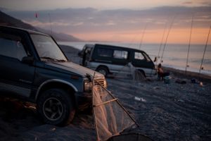 Beach cars and fishing poles
