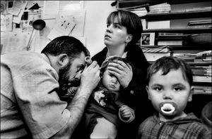 Dr Keith McCollum in his Keady surgery checking out a child's ear infection, 1998