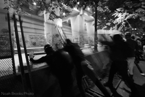 Activists push barricade.