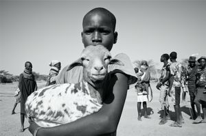 Girl Holding He Goat