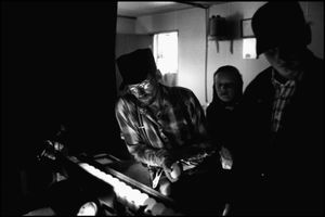 © George Webber - Examining eggs,  2000